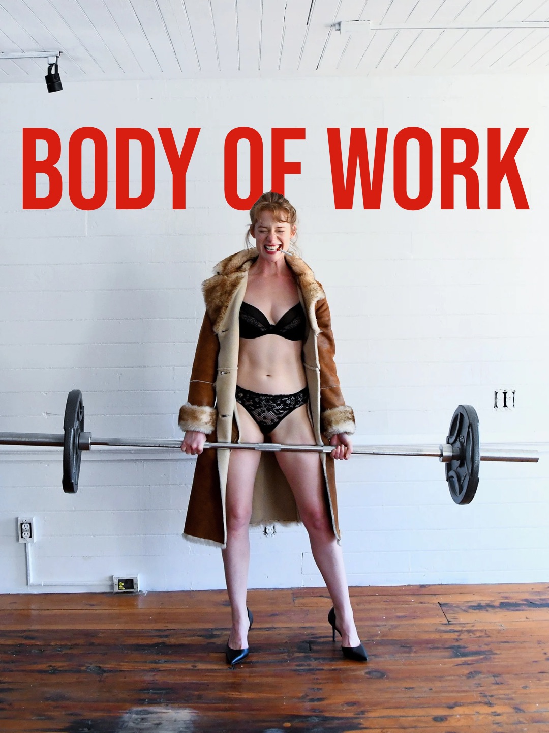 Body of Work poster: Eloise in lingerie and a coat holding a barbell